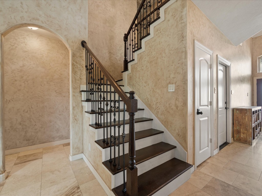 763-806 Lake View Drive Montgomery, TX 77356 - Photo 27 of 43 Elegant wrought-iron staircase finished in real wood & arched hallway detail showcases the beauty of this custom home. Storage Closet under stairs.