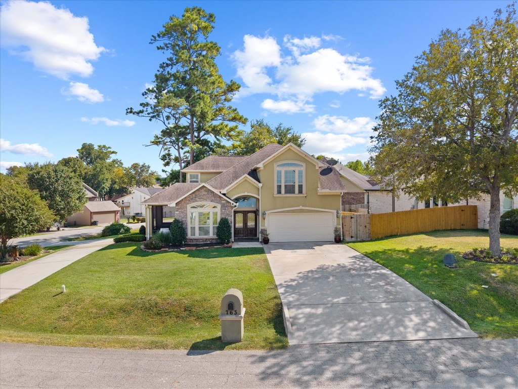 763-806 Lake View Drive Montgomery, TX 77356 - Photo 3 of 43 Sitting on a large corner lot, this custom Stucco home provides two driveways, curb appeal & WATERVIEWS.