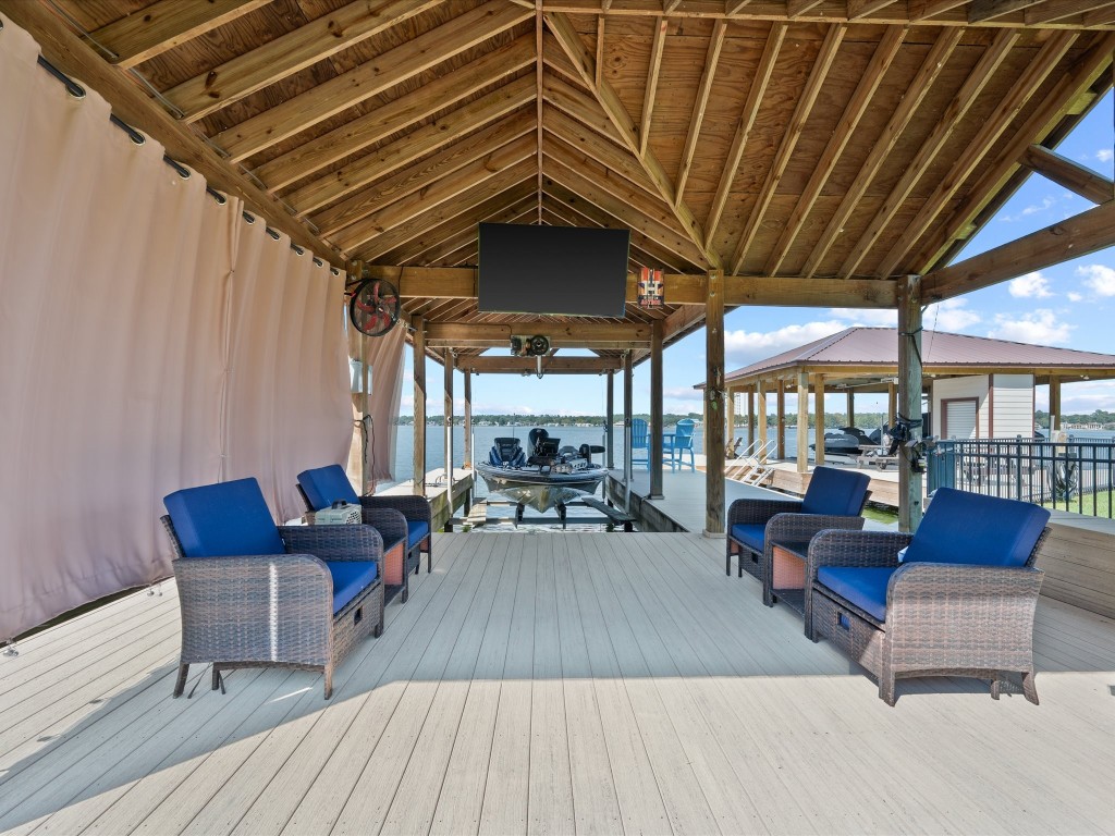 763-806 Lake View Drive Montgomery, TX 77356 - Photo 5 of 43 The boathouse is perfect for entertaining with installed fiberoptics (TV included).