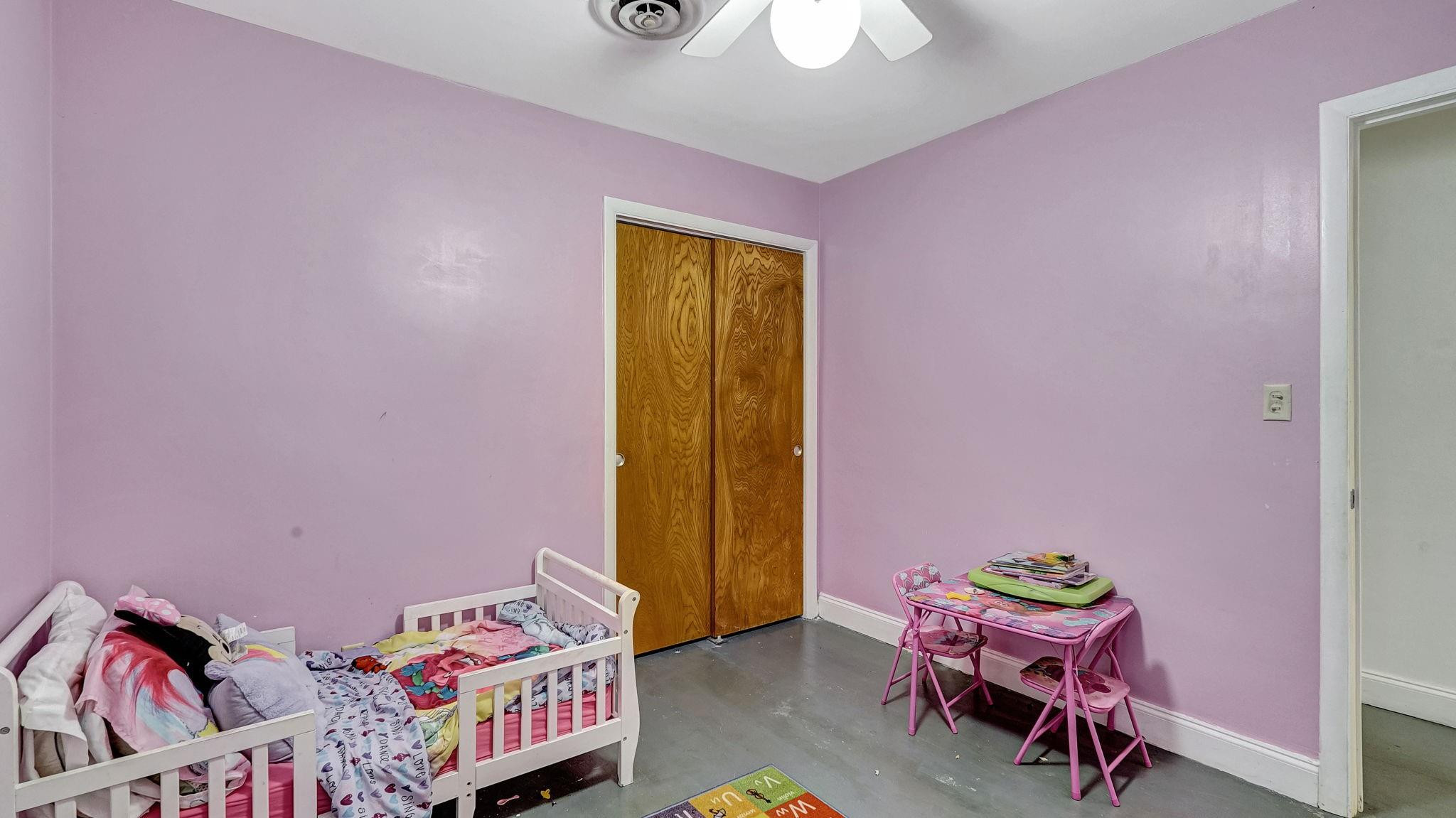 3410 Cleveland Street Hollywood, FL 33021 - Photo 20 of 63 a bedroom with a bed and a window