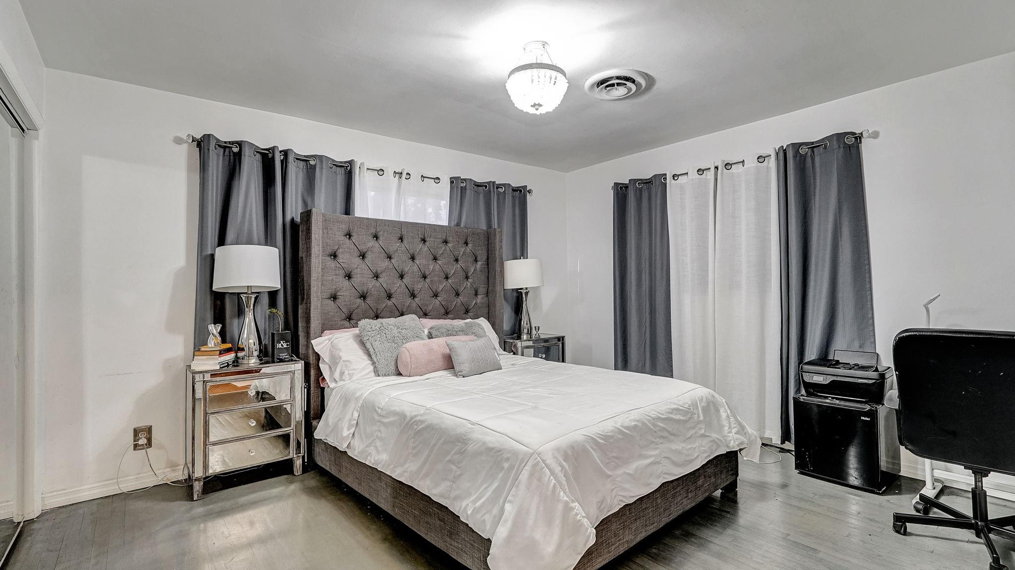 3410 Cleveland Street Hollywood, FL 33021 - Photo 23 of 63 a bedroom with a bed and a television