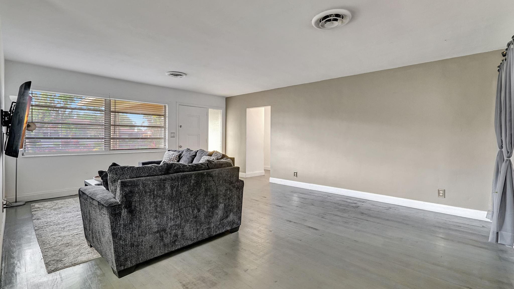 3410 Cleveland Street Hollywood, FL 33021 - Photo 33 of 63 a living room with furniture and a window