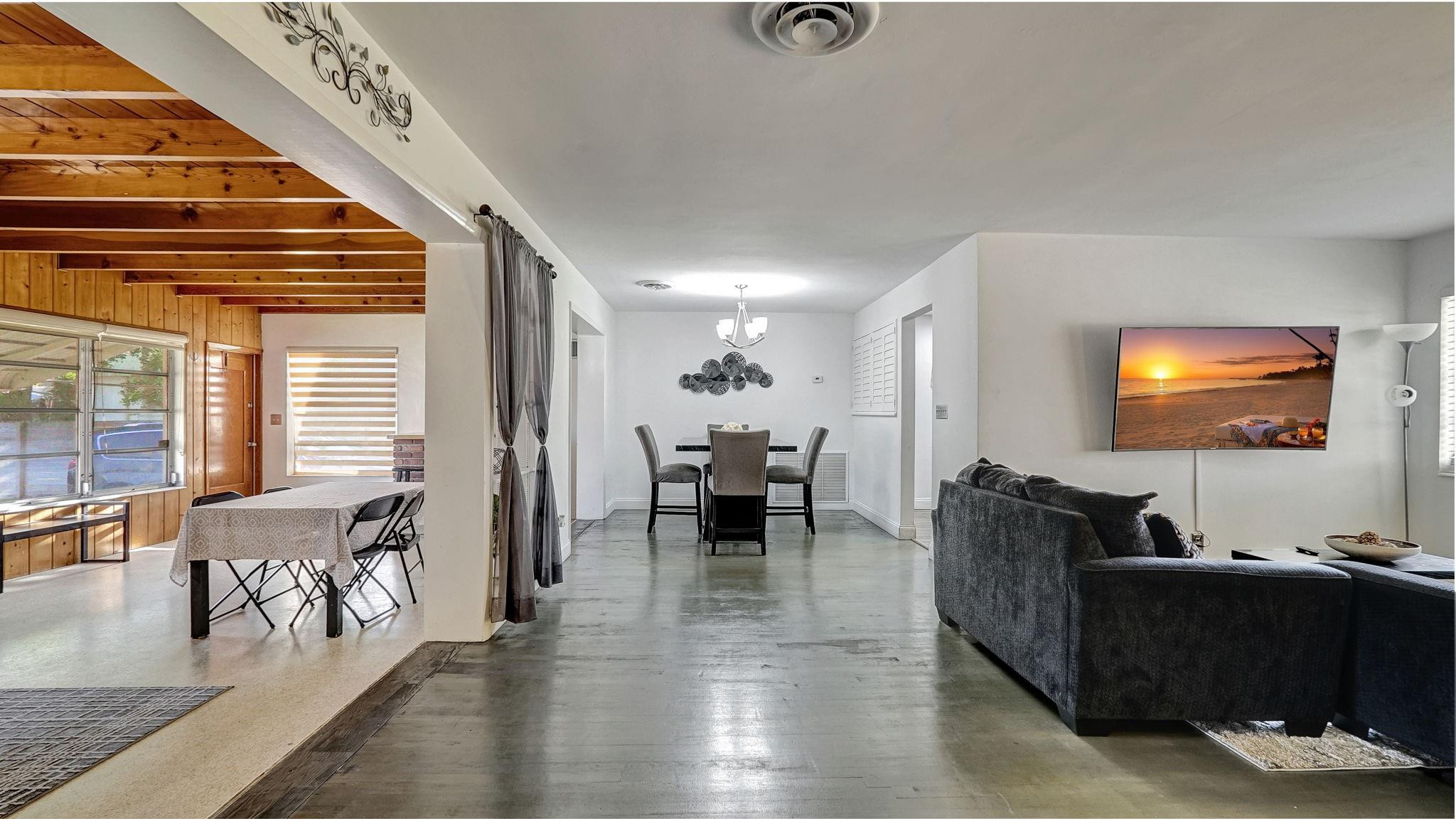 3410 Cleveland Street Hollywood, FL 33021 - Photo 36 of 63 a living room with furniture and a chandelier