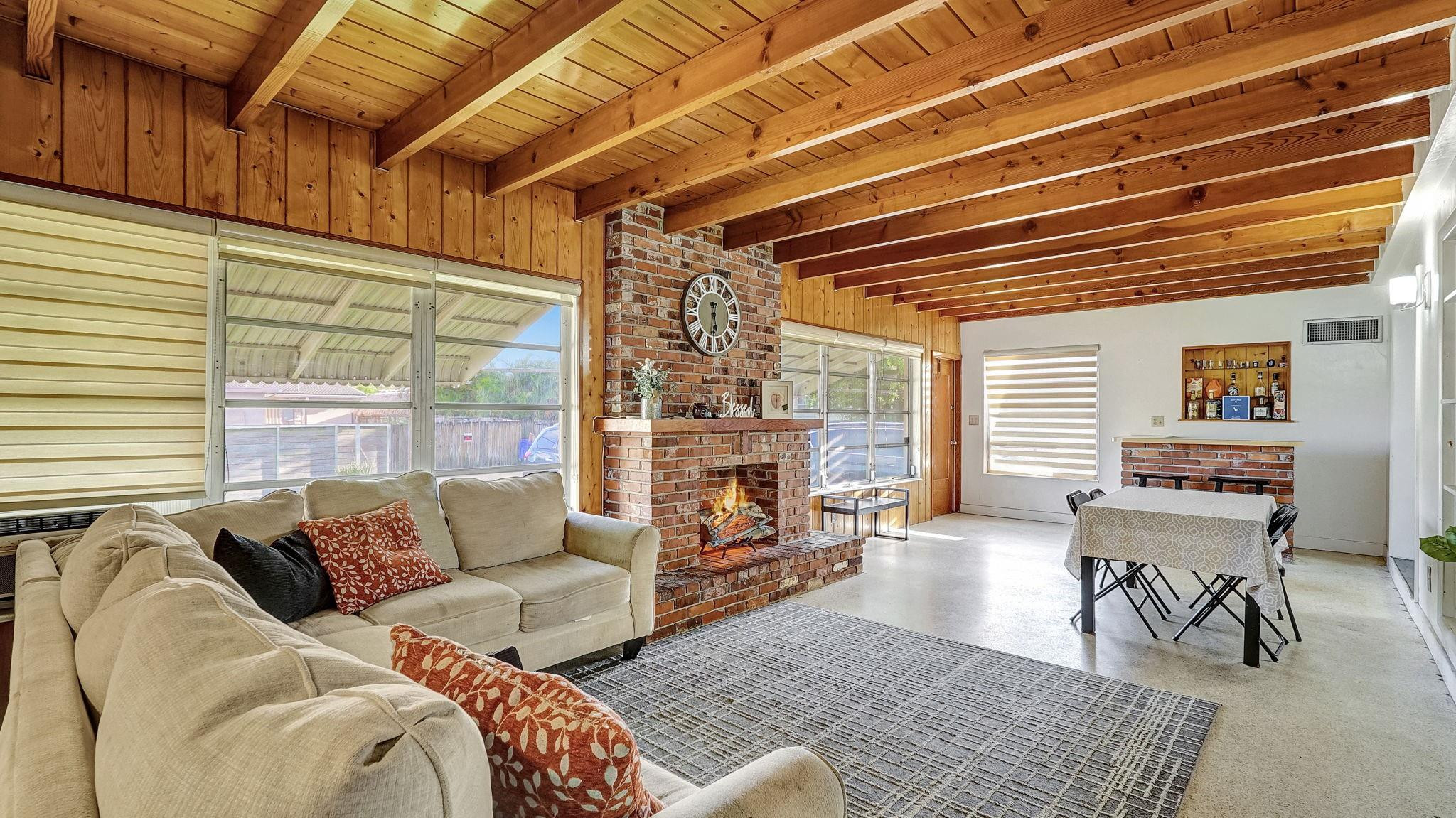 3410 Cleveland Street Hollywood, FL 33021 - Photo 39 of 63 a living room with furniture and a fireplace