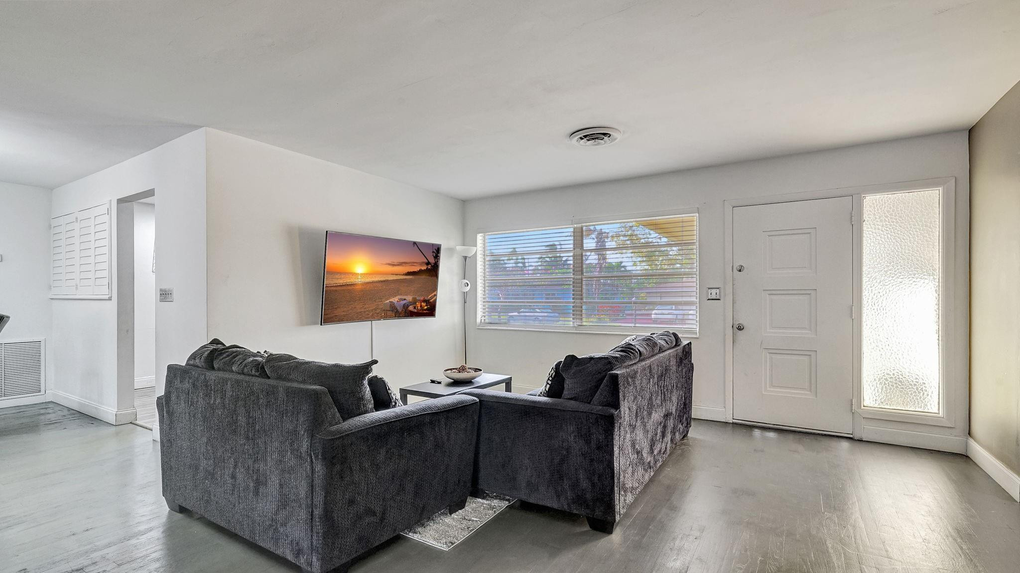 3410 Cleveland Street Hollywood, FL 33021 - Photo 44 of 63 a living room with furniture and a flat screen tv