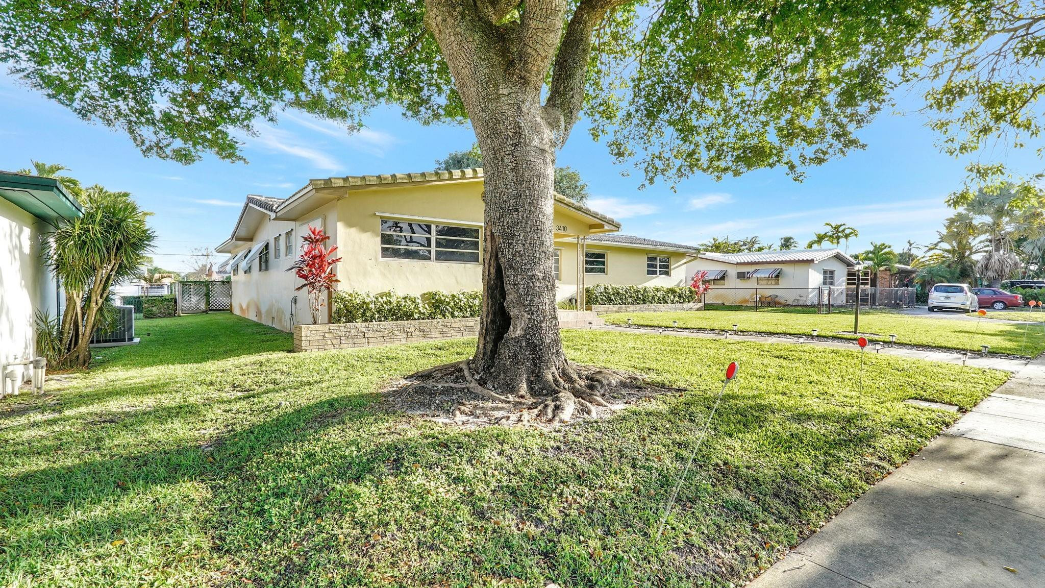 3410 Cleveland Street Hollywood, FL 33021 - Photo 5 of 63 a view of a house with a big yard
