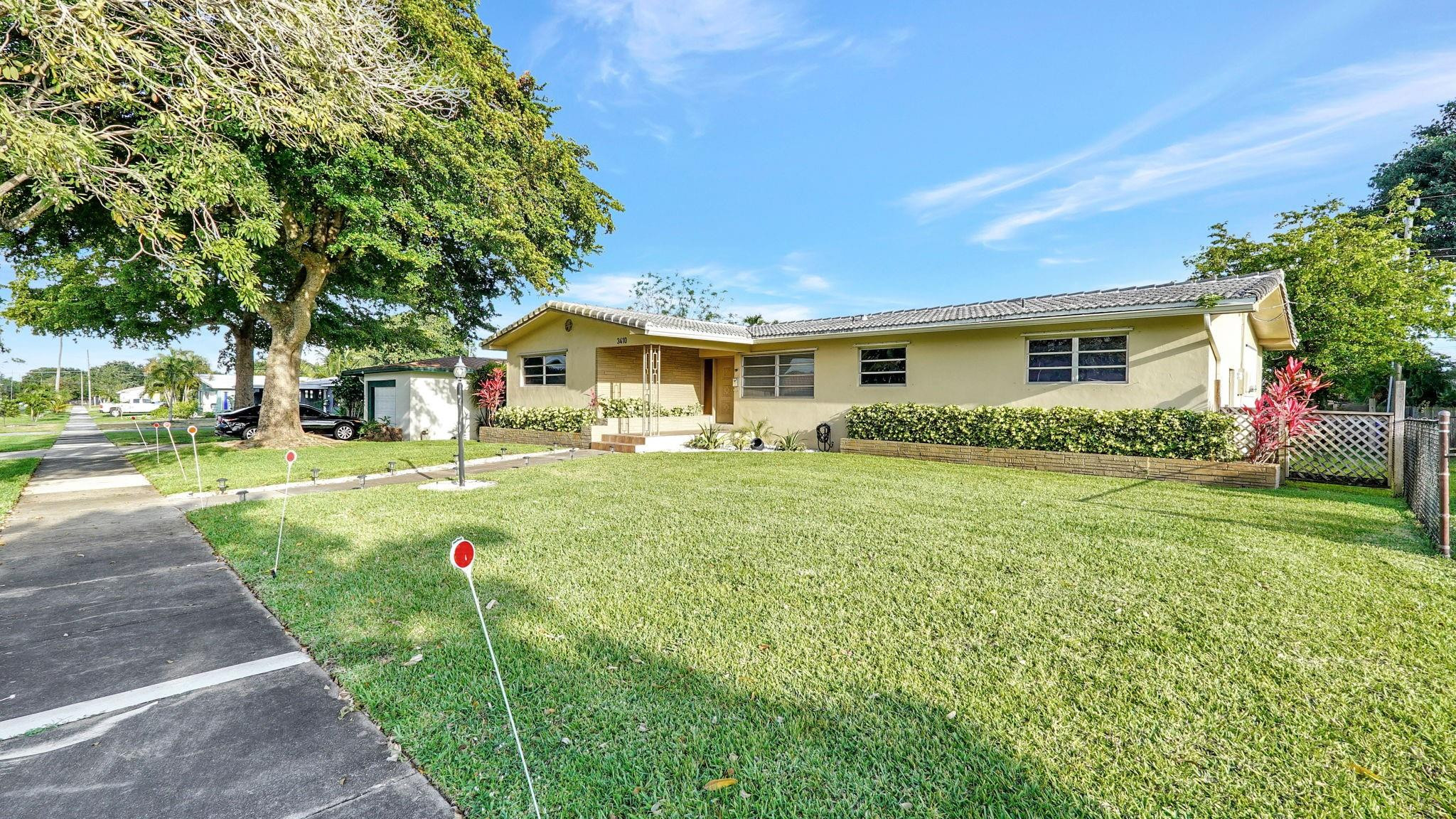 3410 Cleveland Street Hollywood, FL 33021 - Photo 7 of 63 a front view of house with yard and green space