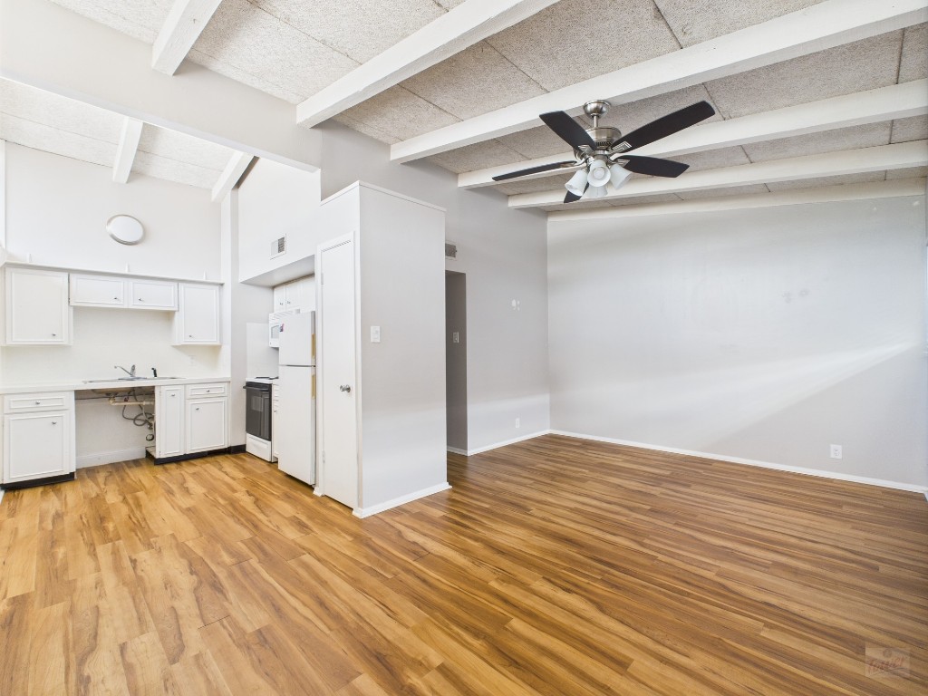2404 Longview Street, Unit 206 Austin, TX 78705 - Photo 15 of 24 a view of empty room with wooden floor and fan