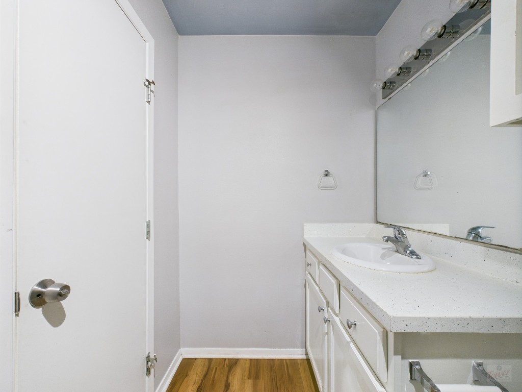 2404 Longview Street, Unit 206 Austin, TX 78705 - Photo 22 of 24 a bathroom with a sink and a mirror