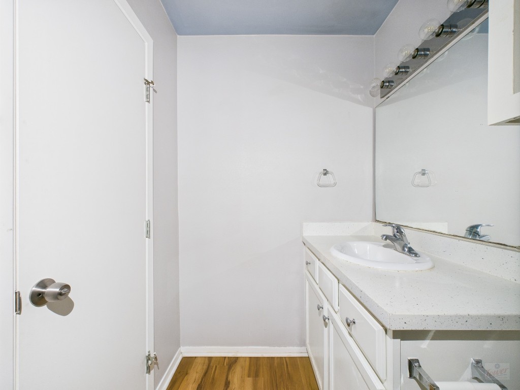 2404 Longview Street, Unit 206 Austin, TX 78705 - Photo 23 of 24 a bathroom with a sink and a mirror