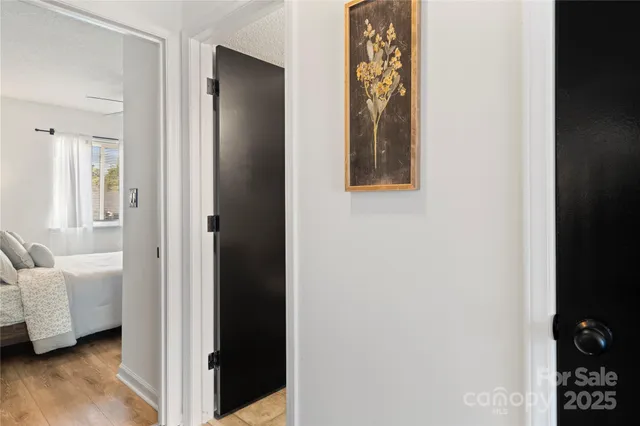 a view of a bedroom from a hallway