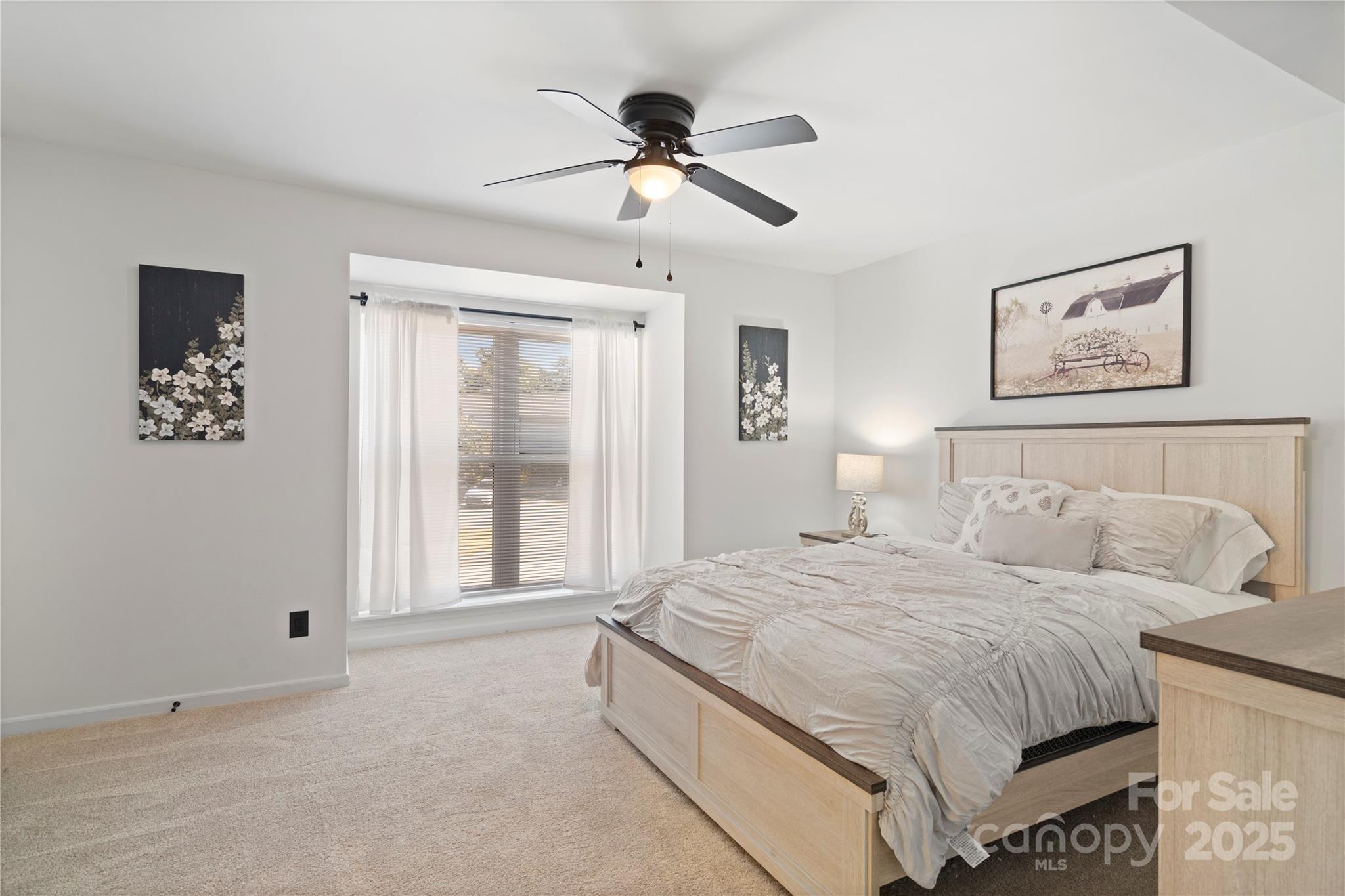 11123 Harrowfield Road Charlotte, NC 28226 - Photo 13 of 20 a spacious bedroom with a bed and window