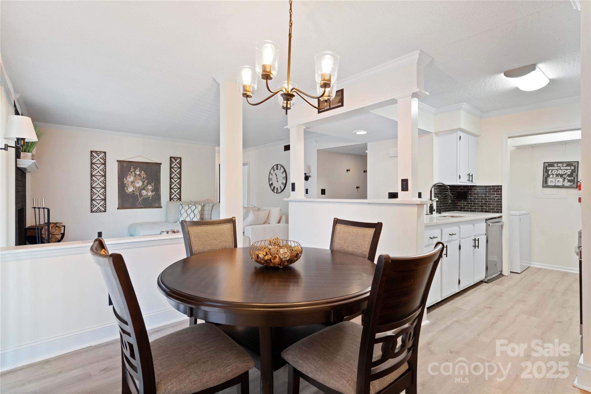 11123 Harrowfield Road Charlotte, NC 28226 - Photo 5 of 20 a view of a dining room with furniture and wooden floor