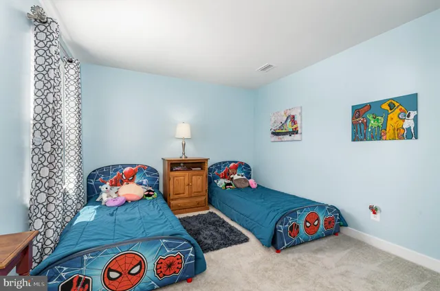 a bedroom with toys and a book shelf