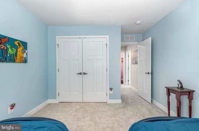 a view of room with furniture and wooden floor