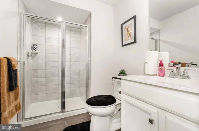 a bathroom with a toilet and a shower