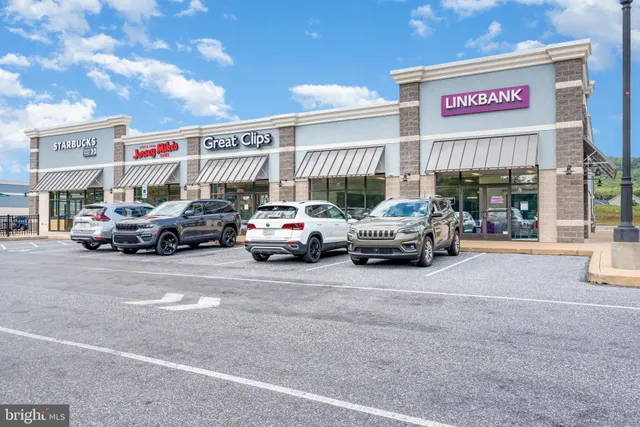 a view of cars parked in front of a building