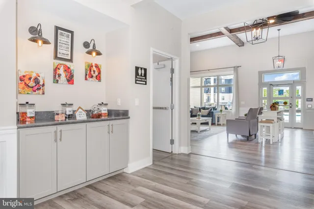 a view of kitchen with furniture and wooden floor