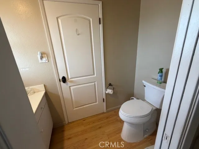 a white toilet sitting next to a sink