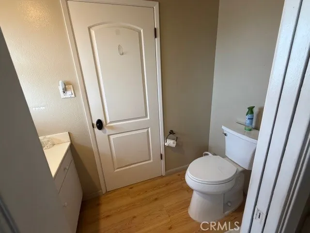 a white toilet sitting next to a sink