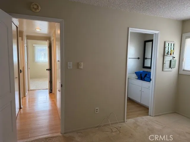 wooden floor with a bathroom