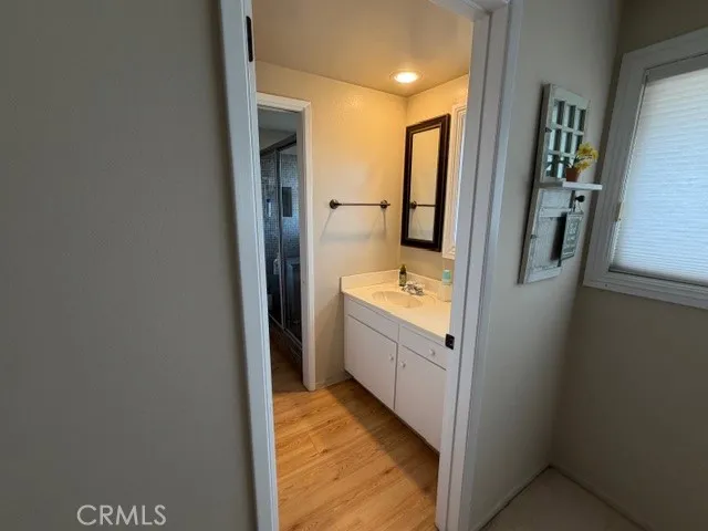 a bathroom with a bathtub sink and mirror