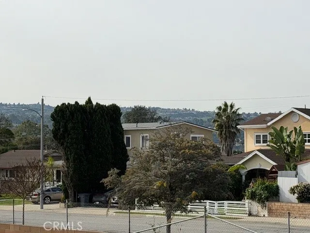 a view of a street with a building in the background