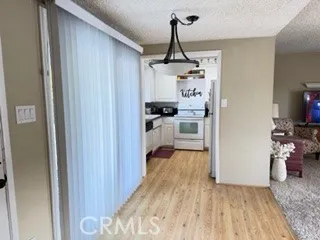 a kitchen with a stove and a refrigerator