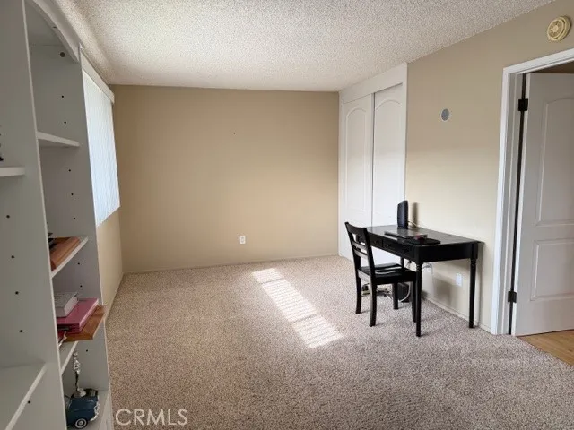 a workspace with furniture and a window