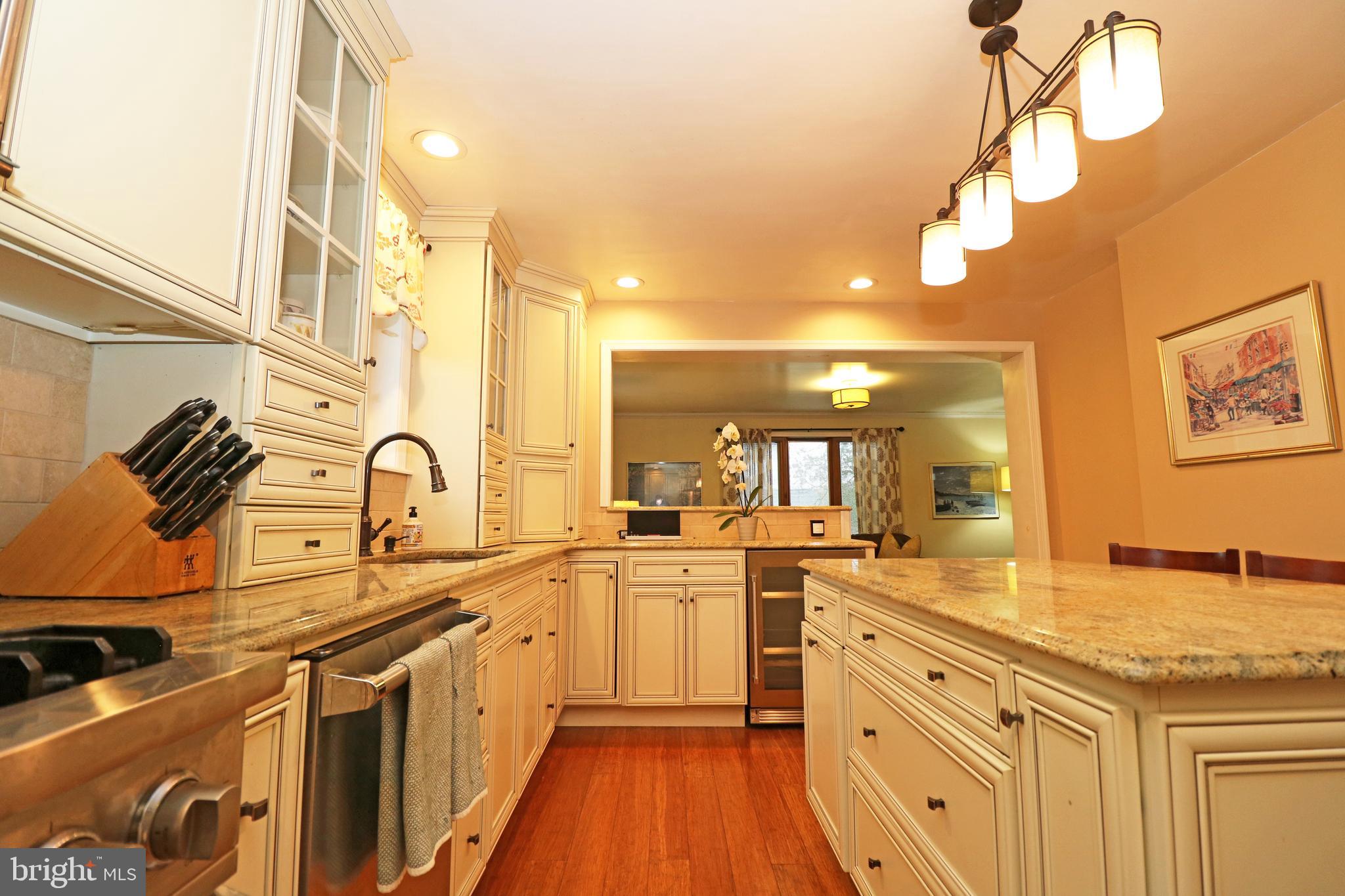 371 Southcroft Road Springfield, PA 19064 - Photo 13 of 42 a kitchen with stainless steel appliances granite countertop a sink and cabinets