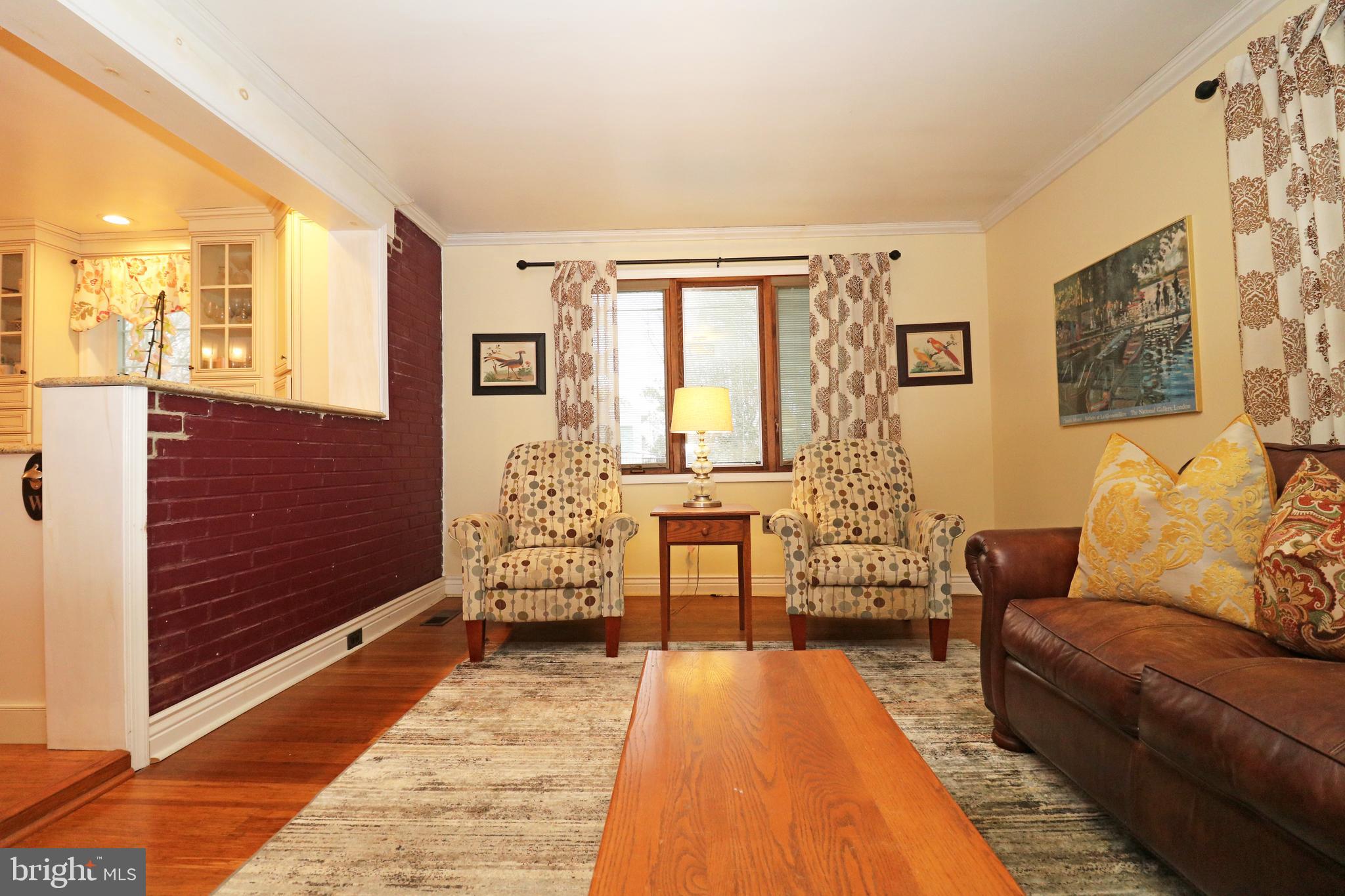 371 Southcroft Road Springfield, PA 19064 - Photo 15 of 42 a living room with furniture and a fireplace