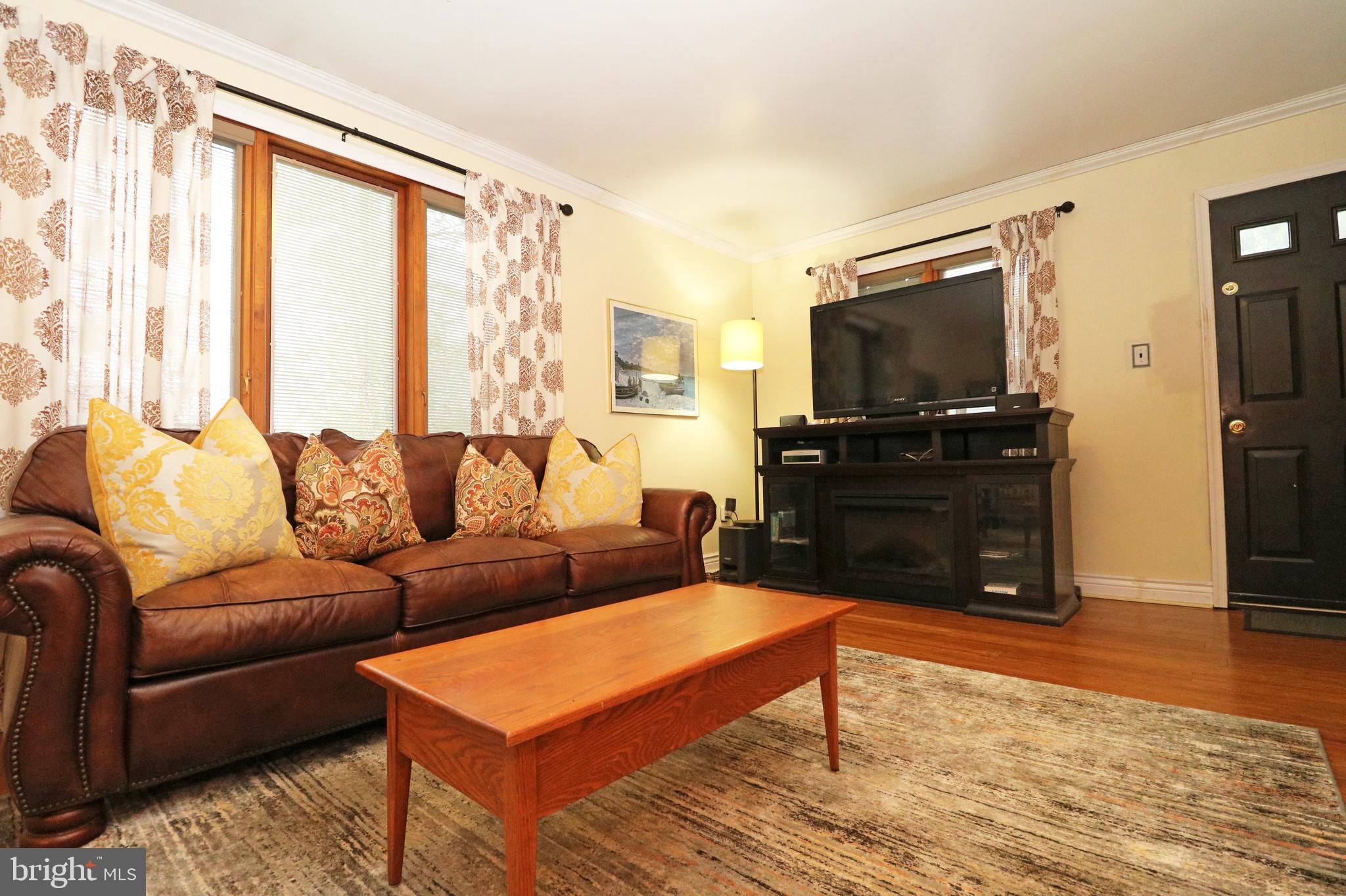 371 Southcroft Road Springfield, PA 19064 - Photo 16 of 42 a living room with furniture and a flat screen tv