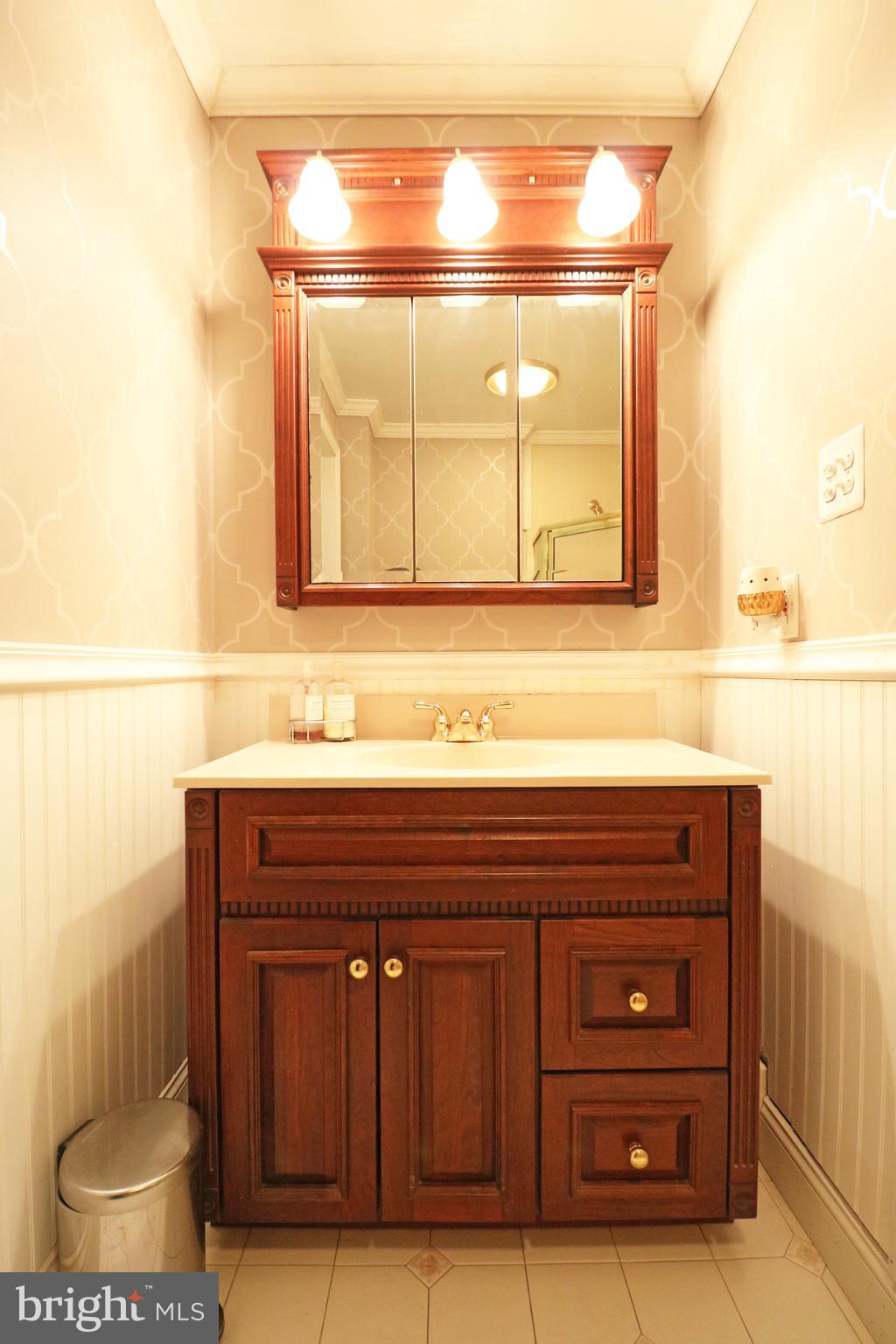371 Southcroft Road Springfield, PA 19064 - Photo 22 of 42 a bathroom with a sink and a mirror