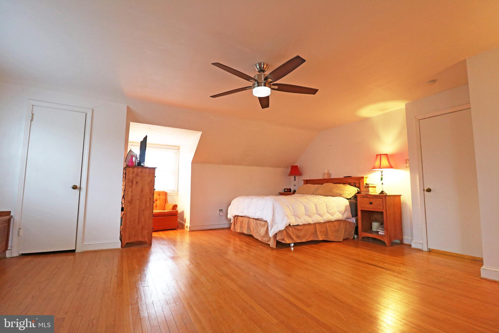 371 Southcroft Road Springfield, PA 19064 - Photo 23 of 42 a bedroom with a bed and wooden floor