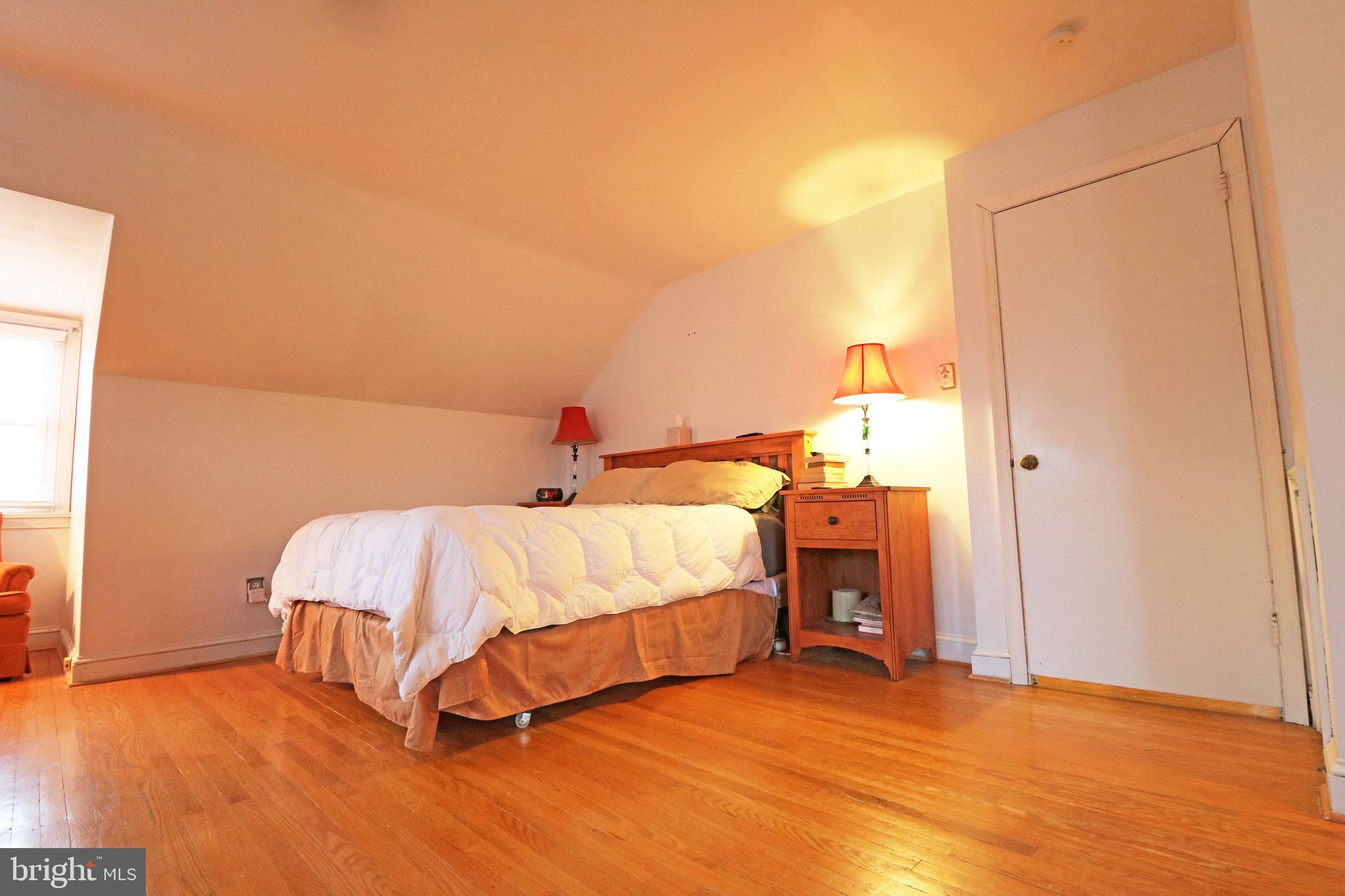 371 Southcroft Road Springfield, PA 19064 - Photo 25 of 42 a bedroom with a bed and a night stand