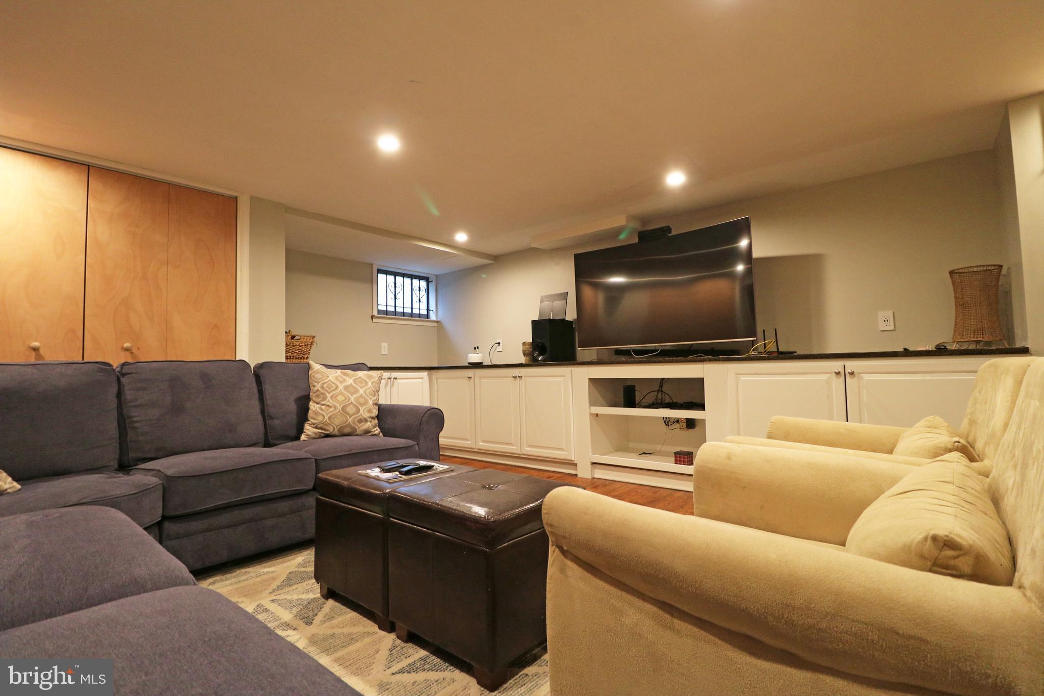 371 Southcroft Road Springfield, PA 19064 - Photo 30 of 42 a living room with furniture and a flat screen tv