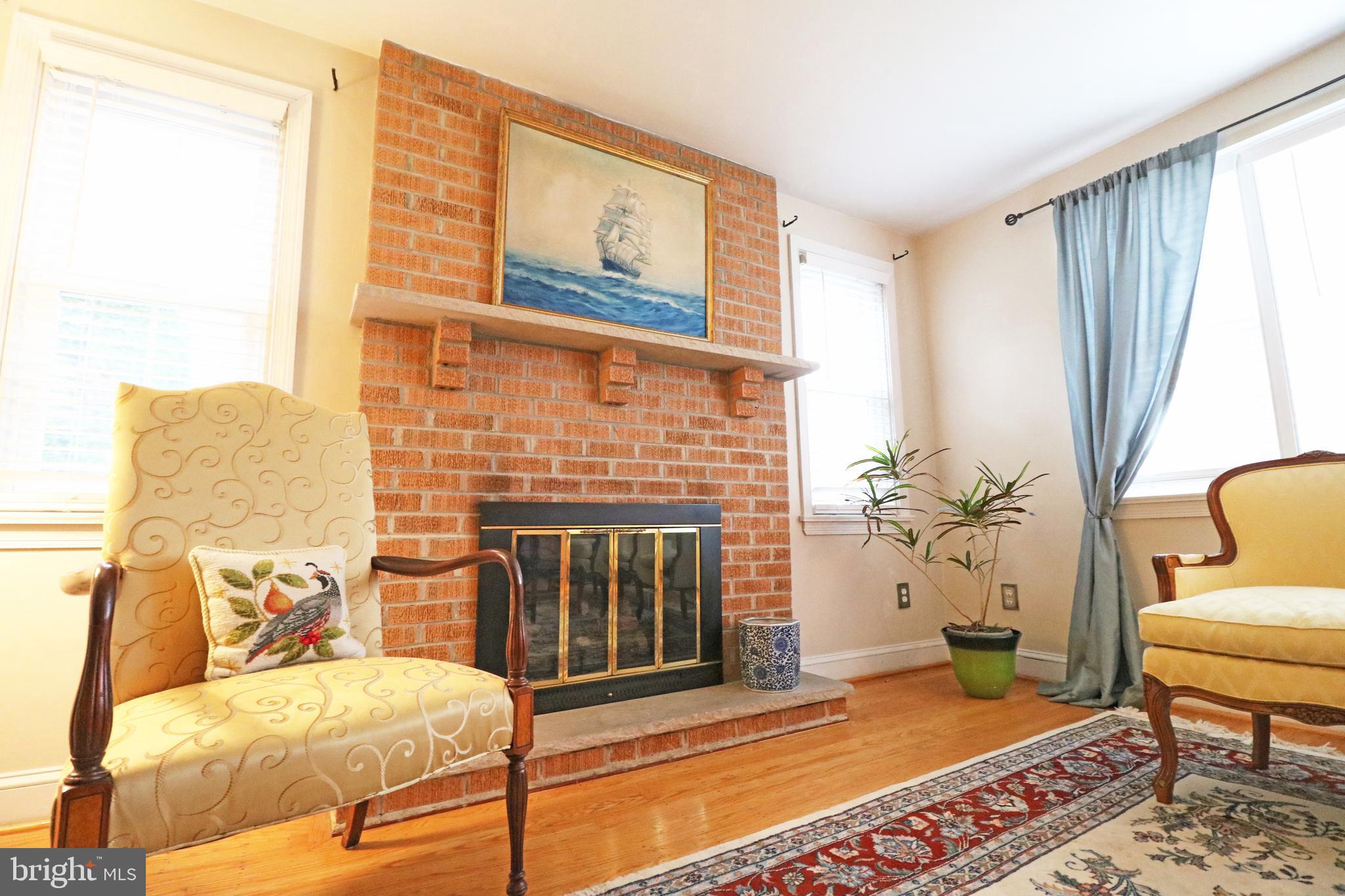 371 Southcroft Road Springfield, PA 19064 - Photo 3 of 42 a living room with furniture and a fireplace
