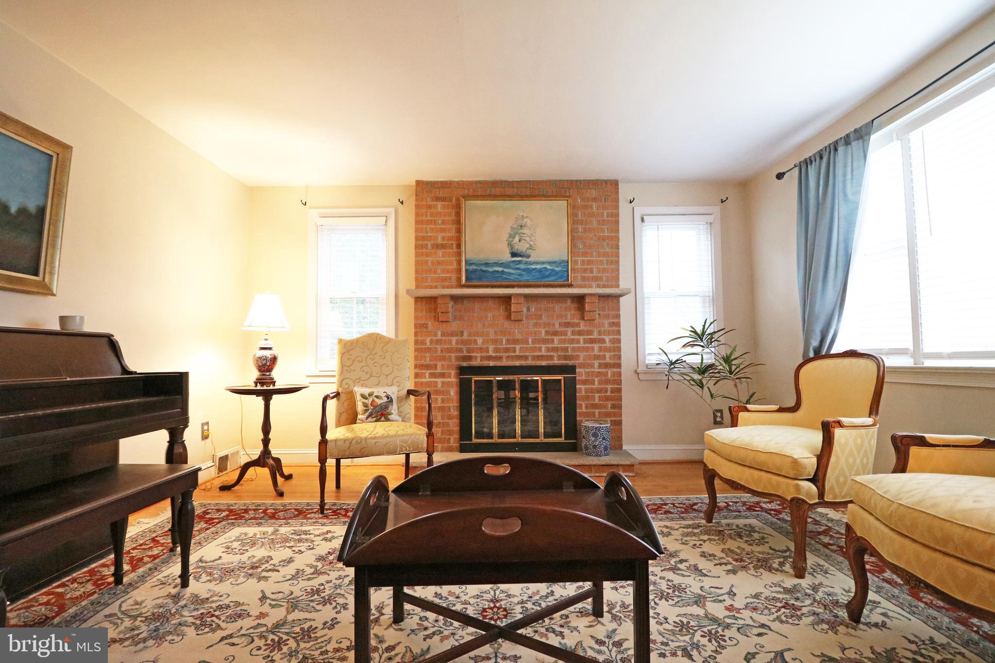 371 Southcroft Road Springfield, PA 19064 - Photo 4 of 42 a living room with furniture and a fireplace