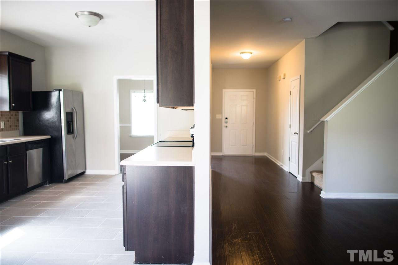 5625 Quitman Trail Raleigh, NC 27610 - Photo 3 of 4 a kitchen with stainless steel appliances a refrigerator and a stove