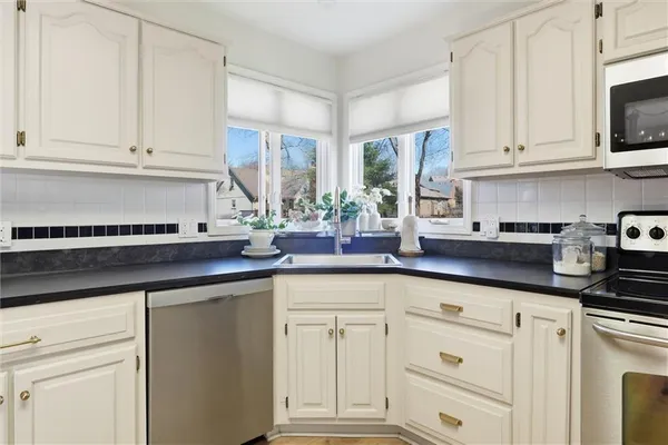 $435,000 | 4070 Southwest Camelot Drive, Lee's Summit, MO 64082