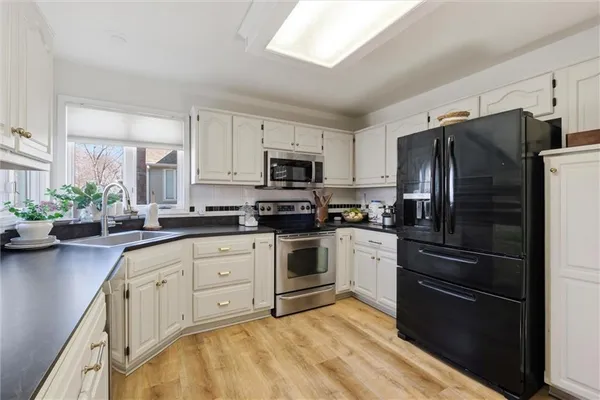 $435,000 | 4070 Southwest Camelot Drive, Lee's Summit, MO 64082