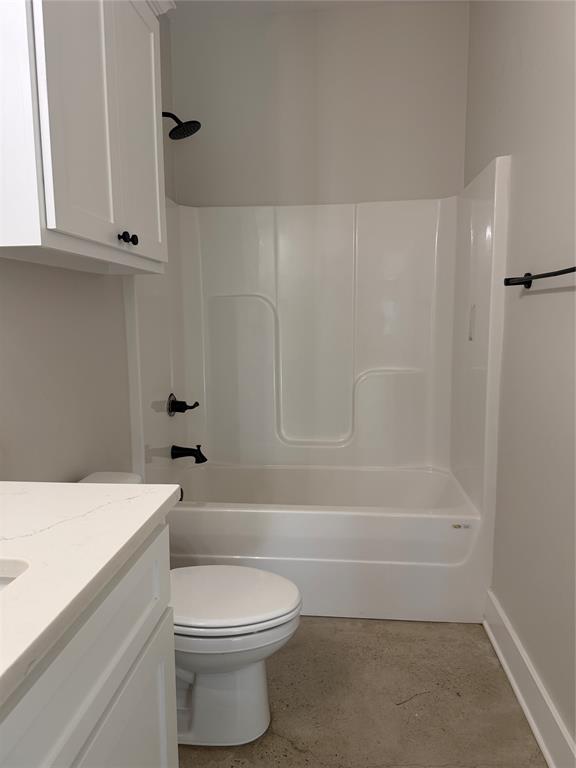 304 Lake Road Plain Dealing, LA 71064 - Photo 6 of 16 a bathroom with a toilet a sink and bathtub