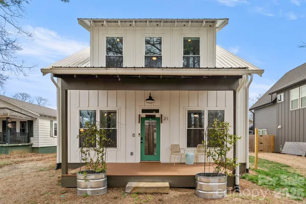 a view of a house with outdoor seating