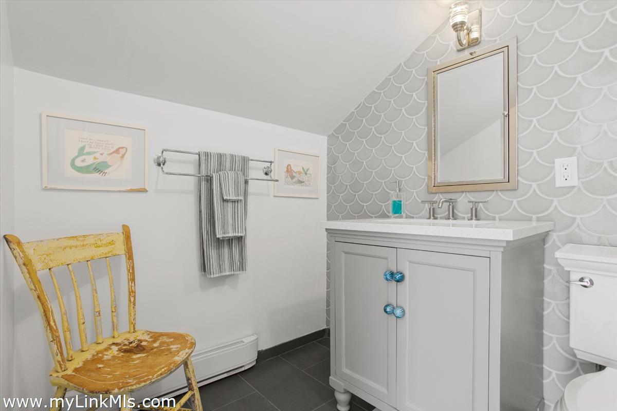13 Parson Lane Nantucket, MA 02554 - Photo 35 of 44 a bathroom with a sink mirror vanity and toilet