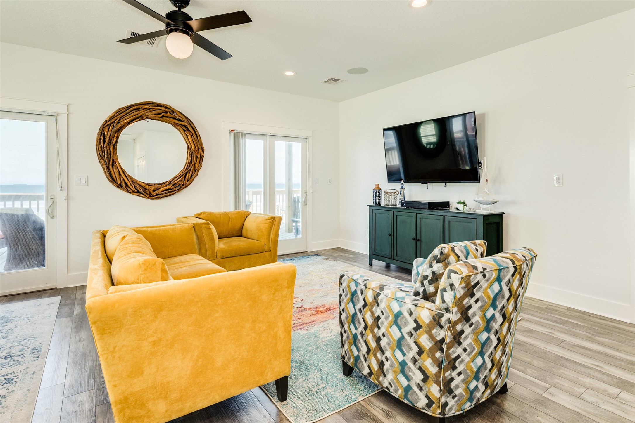 109 D Santar Loop Surfside Beach, TX 77541 - Photo 12 of 42 a living room with furniture a flat screen tv and a fireplace