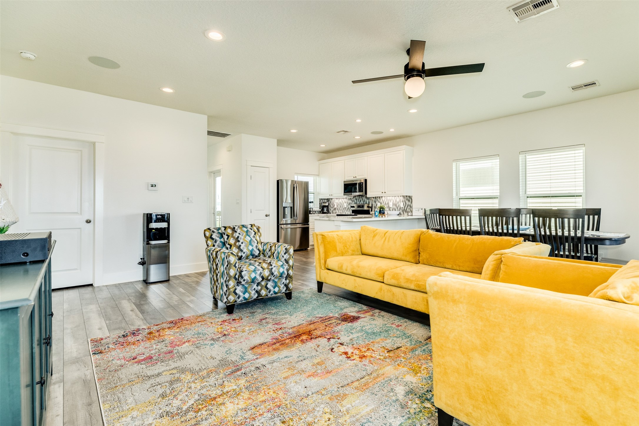 109 D Santar Loop Surfside Beach, TX 77541 - Photo 13 of 42 a living room with furniture kitchen view and a wooden floor