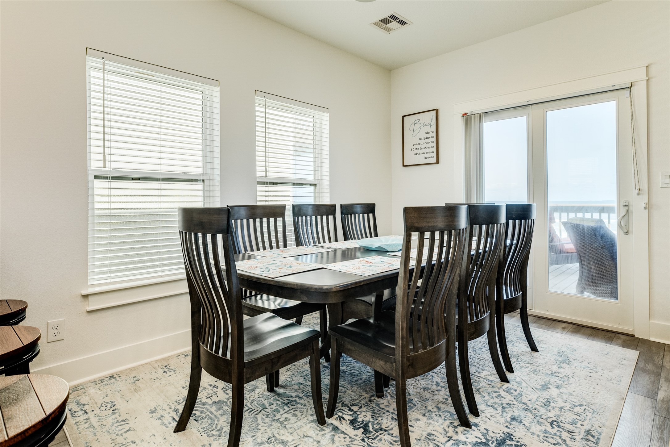 109 D Santar Loop Surfside Beach, TX 77541 - Photo 14 of 42 a view of a dining room with furniture and wooden floor