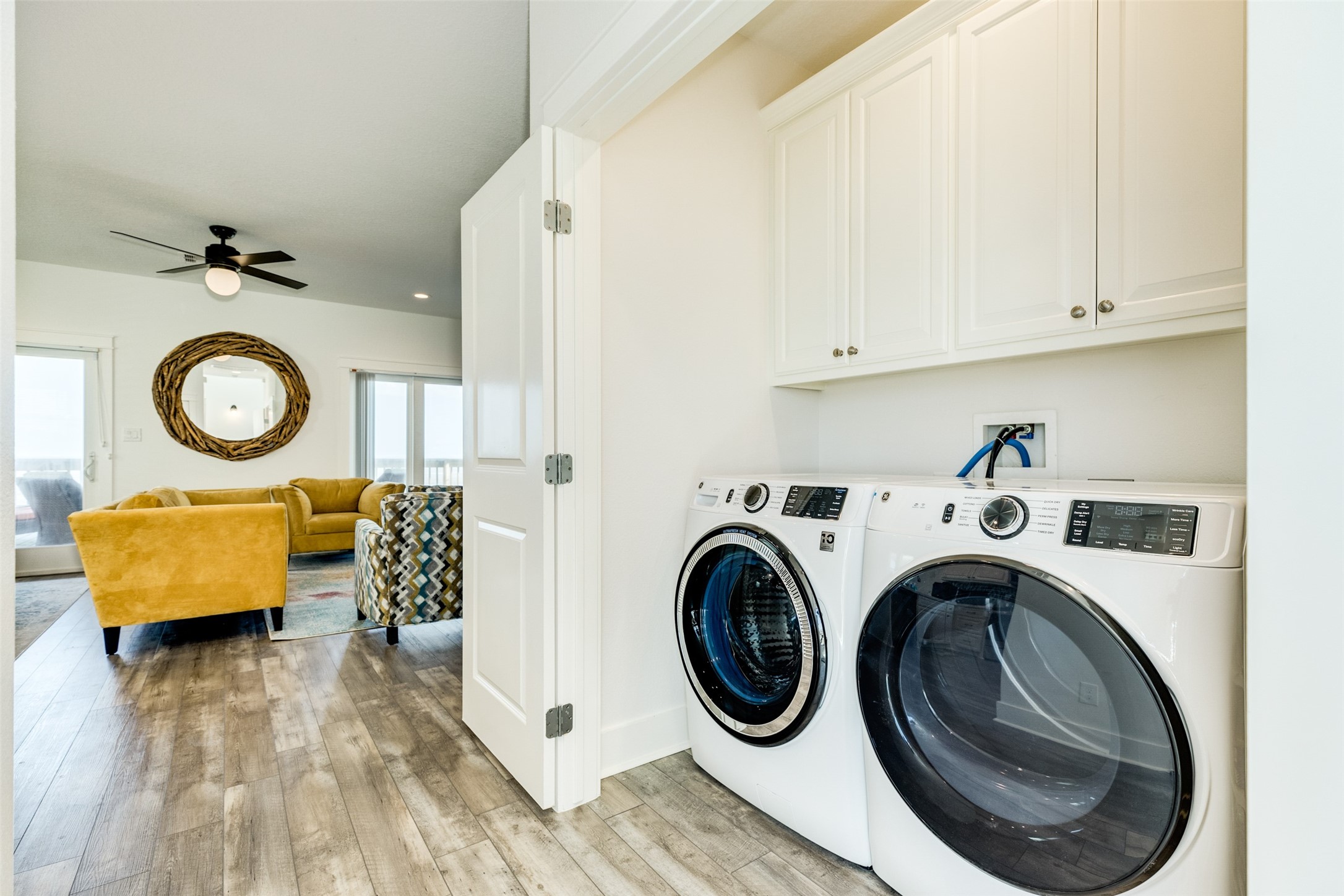 109 D Santar Loop Surfside Beach, TX 77541 - Photo 19 of 42 a view of storage and utility room with washer and dryer