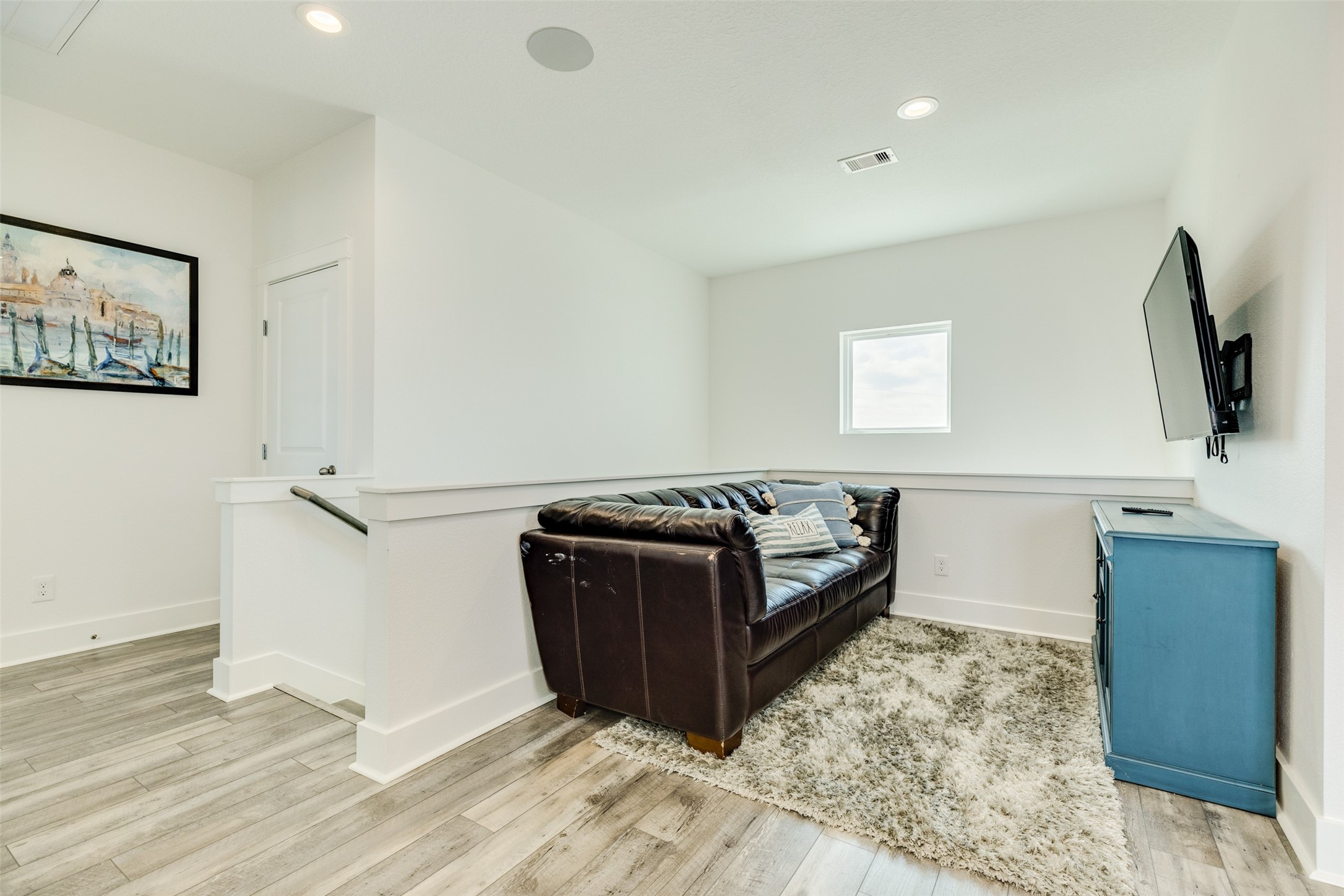 109 D Santar Loop Surfside Beach, TX 77541 - Photo 22 of 42 a living room with a bed furniture and a flat screen tv