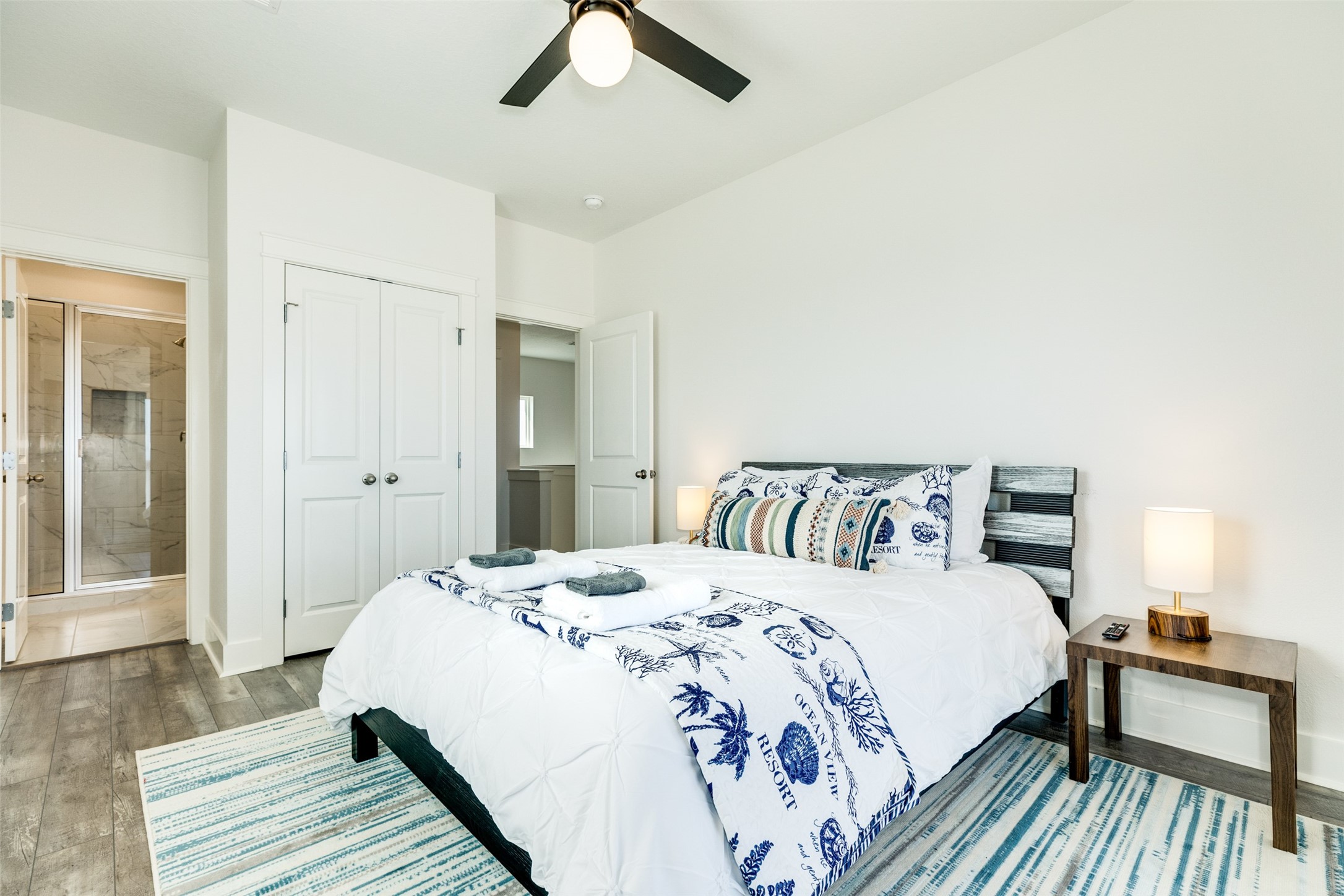 109 D Santar Loop Surfside Beach, TX 77541 - Photo 25 of 42 a bed room with a bed and a chandelier